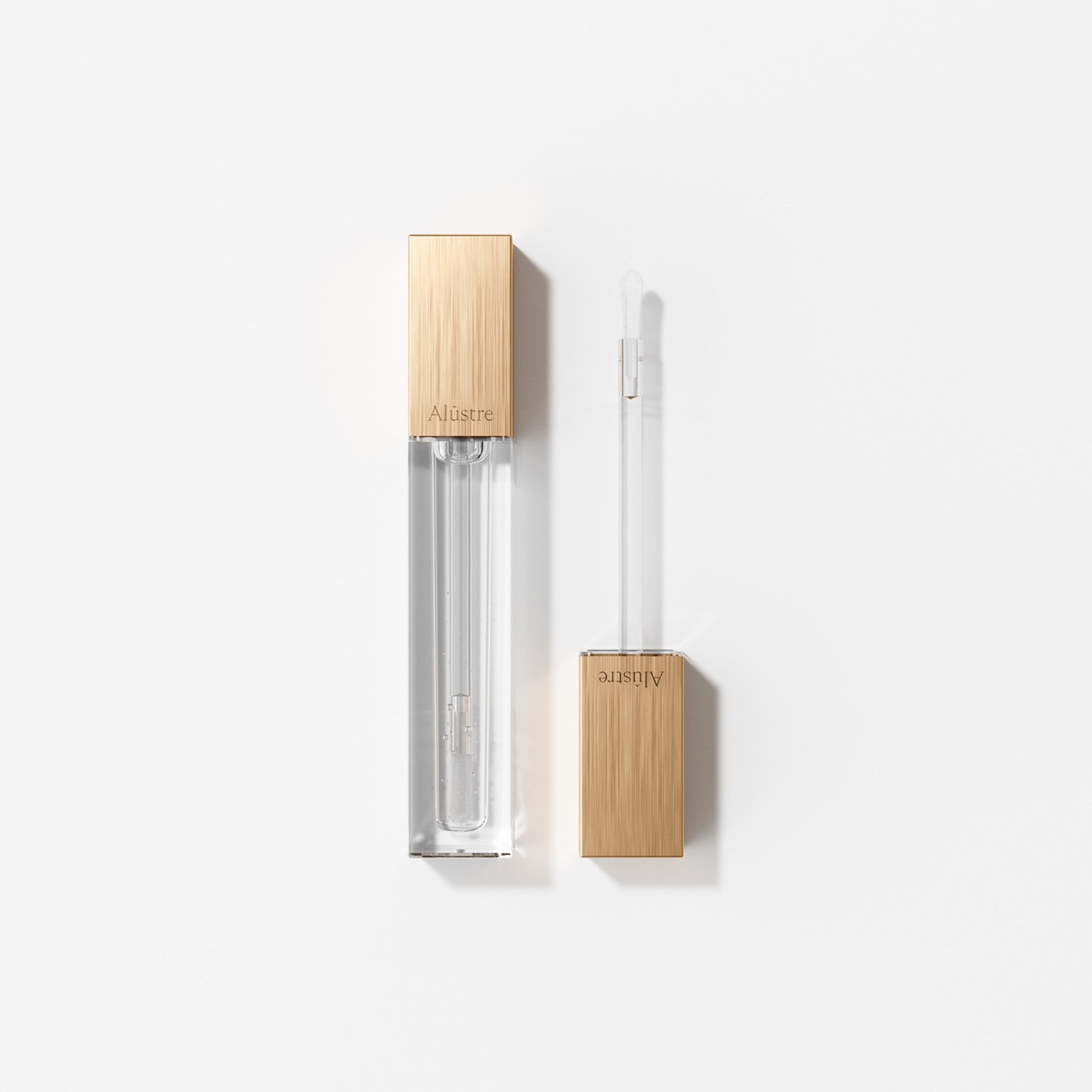 64001 Alustre Packshot Lip Gloss 000 01